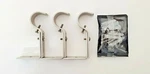 Amazon Basics Set Of 3 Adjustable Nickel Curtain Brackets For 1-INCH Rods Open. Price: $13.00.