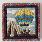 Quilted Hot Air Balloon Wall Art Mountains River Clouds 3D Multicolor 12X12" Used. Price: $27.95.